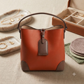 Borsa a secchiello in ecopelle con sacchetto interno e tracolla